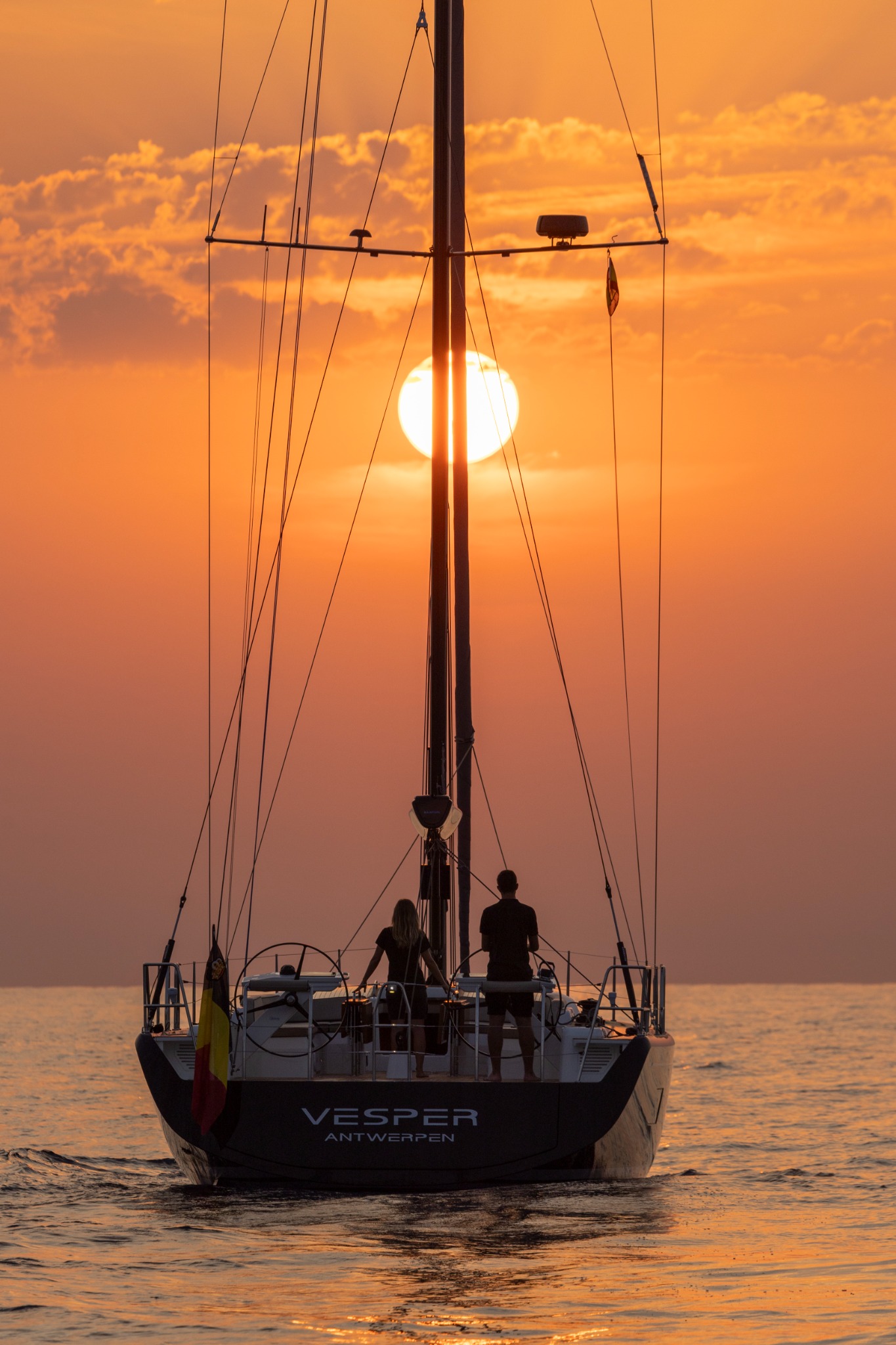 Actual Vesper stern at sunset, with the sun glowing behind the mast